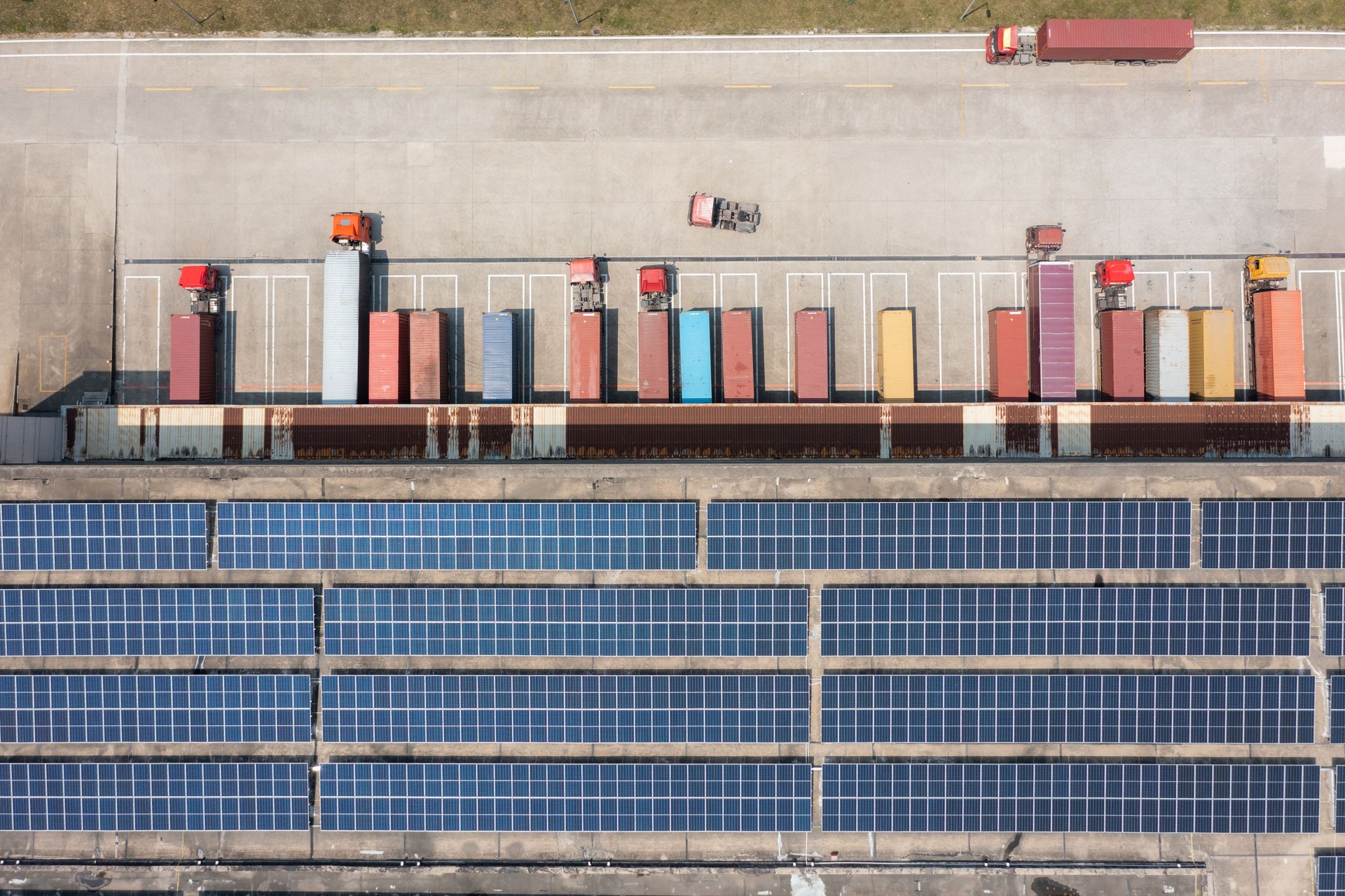 An aerial view of the truck dock and rooftop solar panels at the distribution center